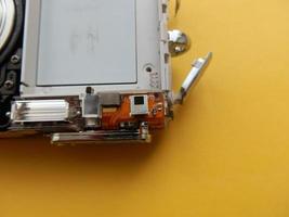 Repair and disassembly of a pocket digital camera photo