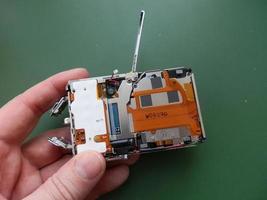 Repair and disassembly of a pocket digital camera photo