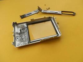 Repair and disassembly of a pocket digital camera photo