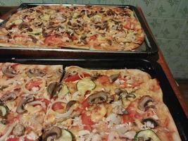 Homemade pizza baked by hand photo