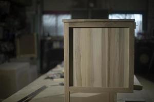 Furniture made of wood in carpentry workshop. Table of boards. photo