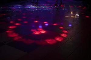 Disco light. Color music on dance floor. Place for dancing. Bright lights. photo