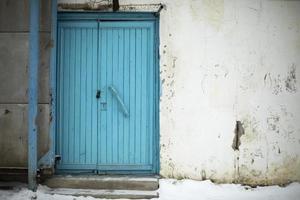 Blue door. Old door to building. Back entrance. Industrial purpose. photo