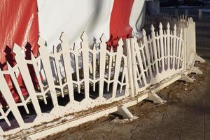 White fence. Small fence made of wood at fair. photo