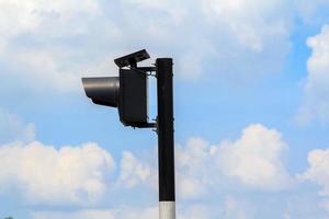 Flashing lights installed at junctions to reduce accidents for drivers to be careful before reaching the junction. The lighting system is used for clean energy. Installed solar panels on top. photo