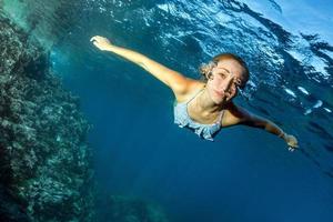 Blonde beautiful Mermaid diver underwater photo