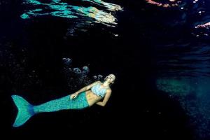 Blonde beautiful Mermaid diver underwater photo