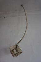 Broken white power cord on white background. Dangerous broken power cords photo