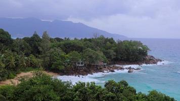 Landscape coast with palm trees and waves in the Seychelles video