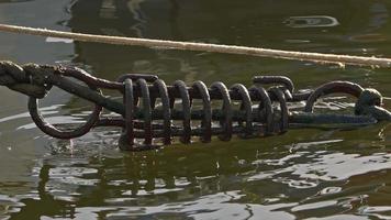 Rusty Metal Boat Rope Mooring Spring in Sea Water