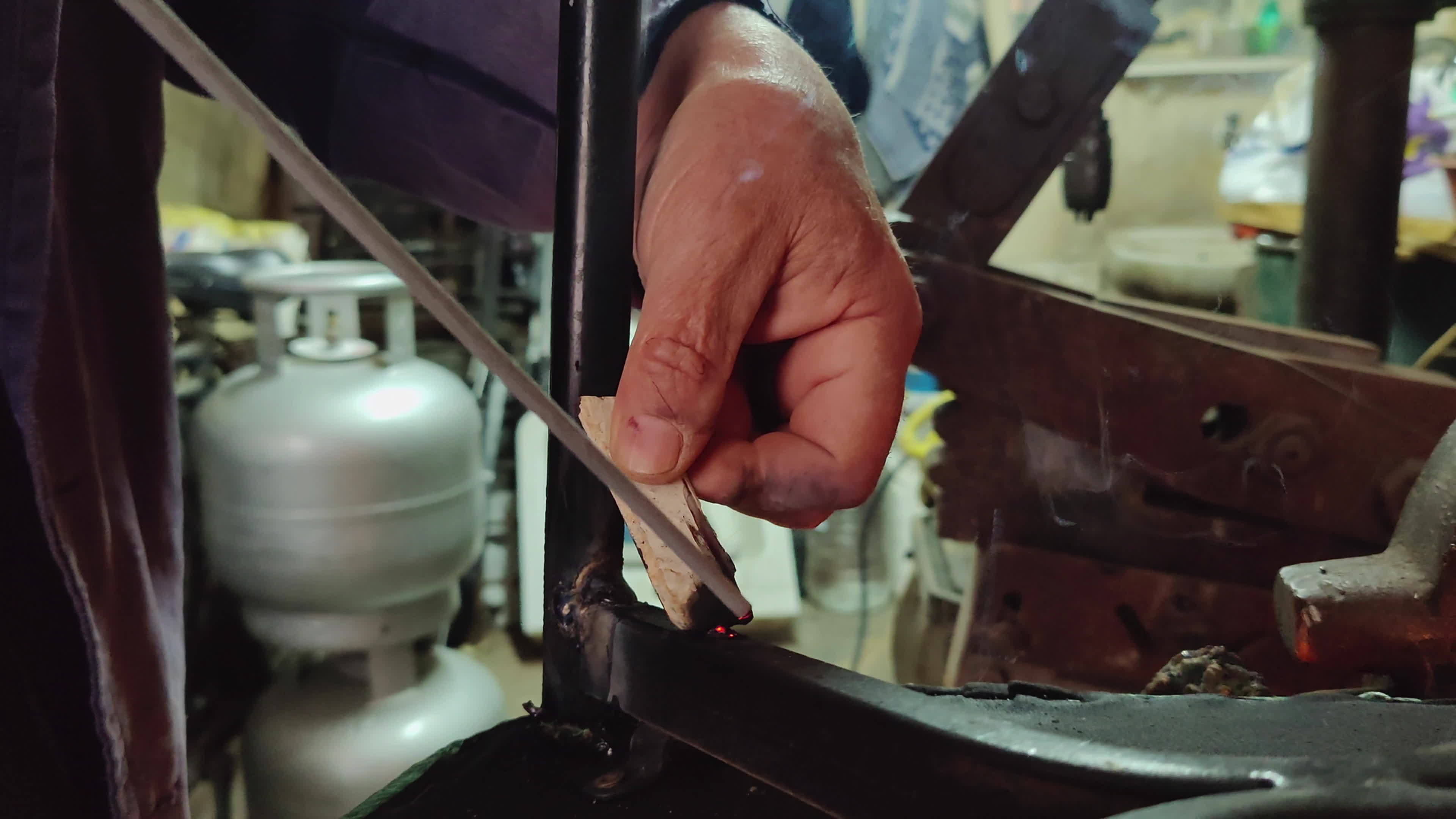 Old Man Repairing Broken Metal Chair Leg With Electric Welding 20379361