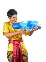 Portrait young man with water gun in Songkran Festival photo