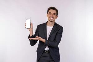 Portrait of young businessman holding smartphone cellphone blank screen with mockup copy space isolated white background photo