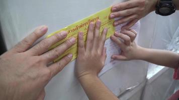 Amphoe Tha Muang Thailand- CIRCA 2021  people pray at Ruamkatanyu Foundation provides coffins to victims killed in accidents that no one comes to make a claim or identify the body in Thailand. video