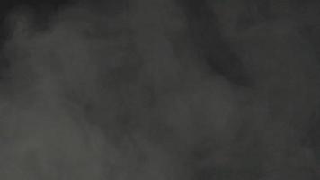 Slow motion of white smoke, fog, mist, vapor on a black background. video