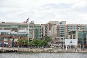 OXON HILL, MD - JUNE 19, 2015 Awakening Sculpture at National Harbor on August 24, 2013 at Oxon Hill, MD USA. A famous 70-foot statue of a giant embedded in the earth created by J. Seward Johnson Jr. photo