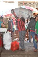 UBUD, INDONESIA - AUGUST 18, 2016 - Local Bali island people selling and buying at town market photo