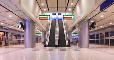 June 2,2022 Bangkok,Thailand timelapse view inside airport rail link train terminal with passenger arriving at suvarnabhumi airport and using escalator. reopening country video