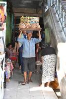 UBUD, INDONESIA - AUGUST 18, 2016 - Local Bali island people selling and buying at town market photo