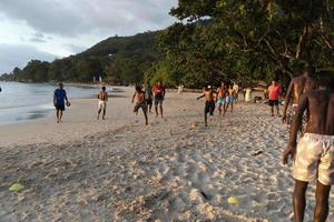 MAHE, SEYCHELLES - AUGUST 13 2019 - Local soccer team training on the beach photo