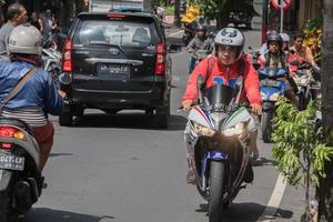 DENPASAR, BALI, INDONESIA - AUGUST 15, 2016 - Indonesia island congested traffic photo