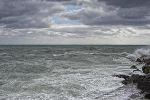 Sea Storm tempest on the rocks photo