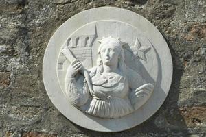 Medieval bas relief Burano Venice photo