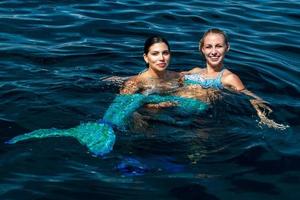 Mexican latina beauty and Blonde beautiful Mermaid photo