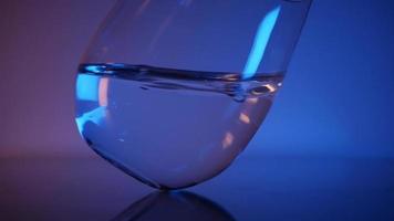 Mineral water in a glass Neon glow video
