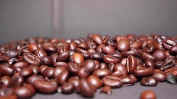 Freshly roasted coffee beans close up video