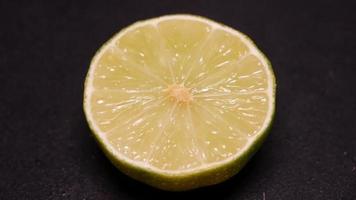 Lime on a black background rotates video