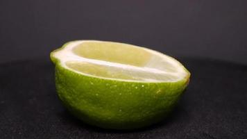 Lime on a black background rotates video