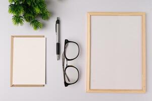 Whiteboard and decorations on white background photo