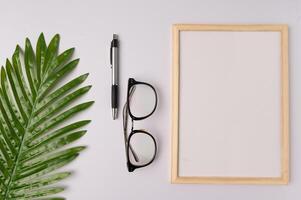 Whiteboard and decorations on white background photo