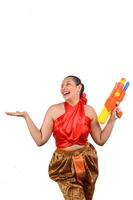 Portrait beautiful woman in Songkran festival with water gun photo