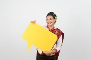 Young beautiful woman in Thai lanna costume with blank speech bubble sign photo