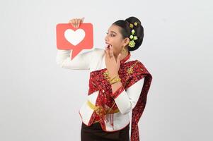 Young beautiful woman in Thai lanna costume with card card in heart symbol photo