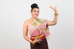 Asian pretty woman in northeastern dress stand in beautiful Thai dance photo