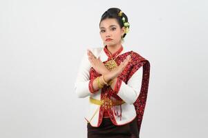 Asian beautiful woman in northeastern dress Cross hands to reject photo