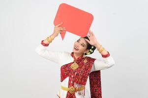 Young beautiful woman in Thai lanna costume with blank speech bubble sign photo