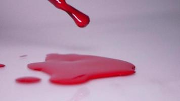 Red nail polish on white background video