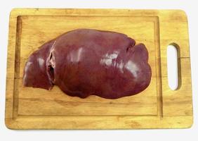 liver on wooden board photo