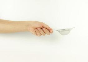 man holding steel sieve  on white background photo