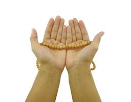 hand with rosary beads in pray pose photo