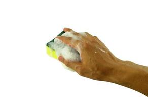 hand holding sponge  for washing on white photo