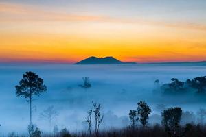 Thung Salaeng Luang National Park,The sun over the mountains and vast grasslands, Phetchabun Province, Thailand photo