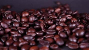 Freshly roasted coffee beans close up video