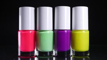 Four neon nail polishes stand in a row video