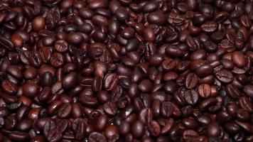 Freshly roasted coffee beans close up video