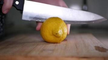 Cut lemon closeup on a wooden board video